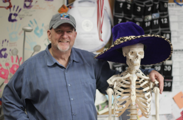 Mr. Monte Jackson posing with Jerry the Skeleton